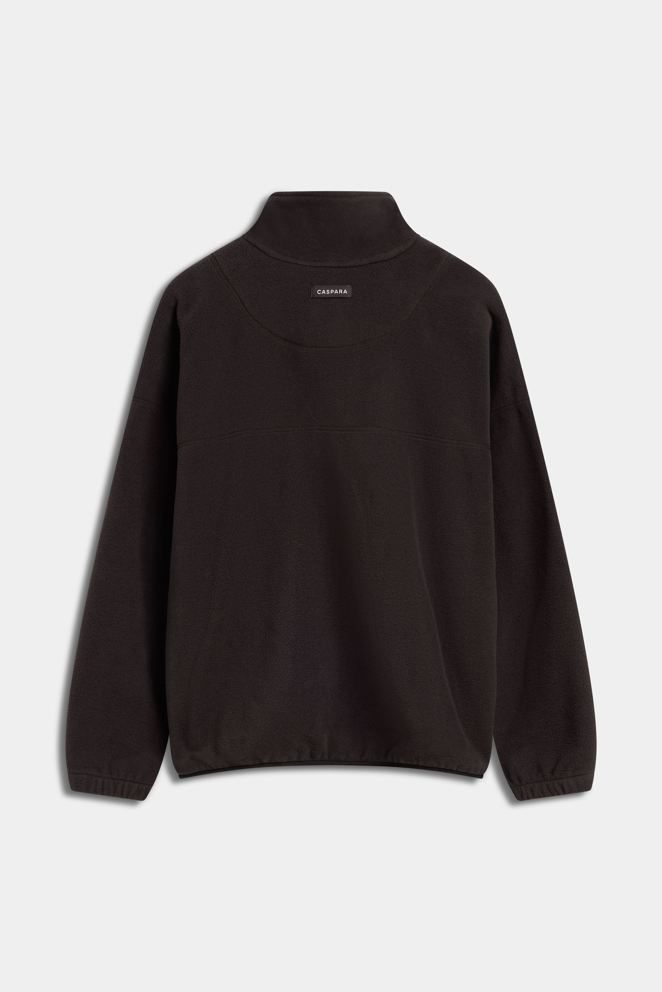 Back view of an espresso CASPARA polar fleece half-snap pullover on a light grey background.